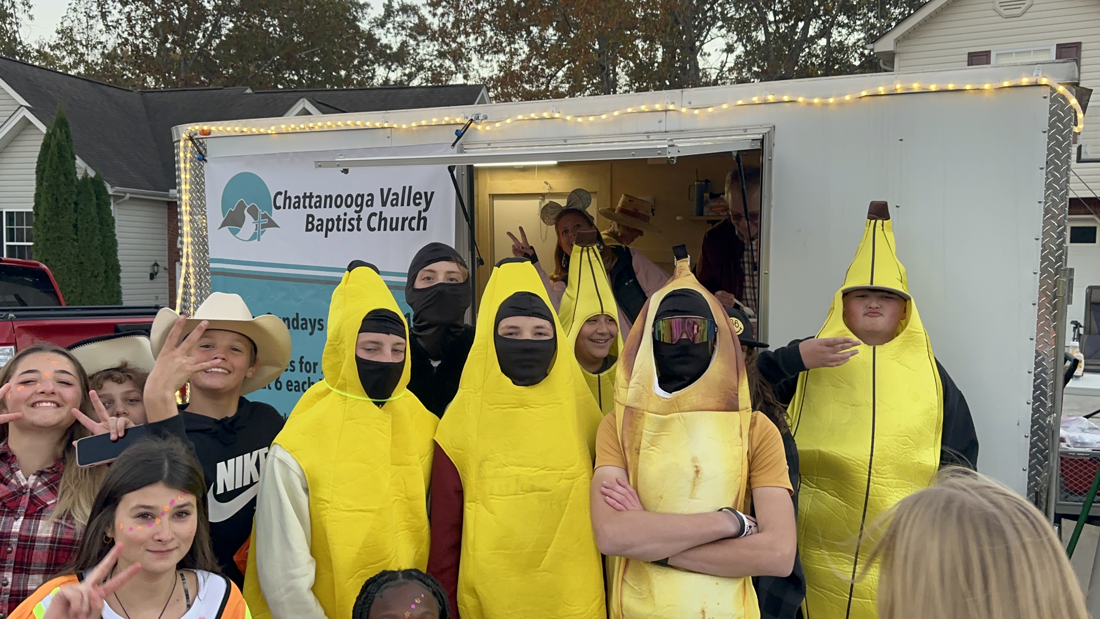 CVBC children and volunteer beside the Go Trailer